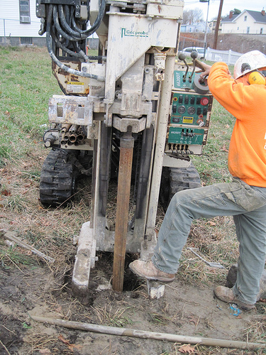 Drilex worker (drilling subcontractor) installs the well casing