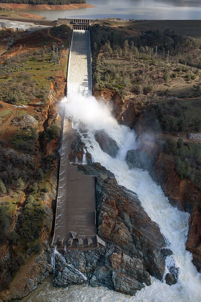 An aerial view of the damaged Oroville Dam spillway as the California Department of Water Resources gradually reduced the outflow from the spillway from 50,000 cubic feet per second (cfs) to zero on February 27, 2017. The reduction allows work to begin to remove debris at the spillway’s base and reduce water surface elevation in the diversion pool. Photo taken February 27, 2017.